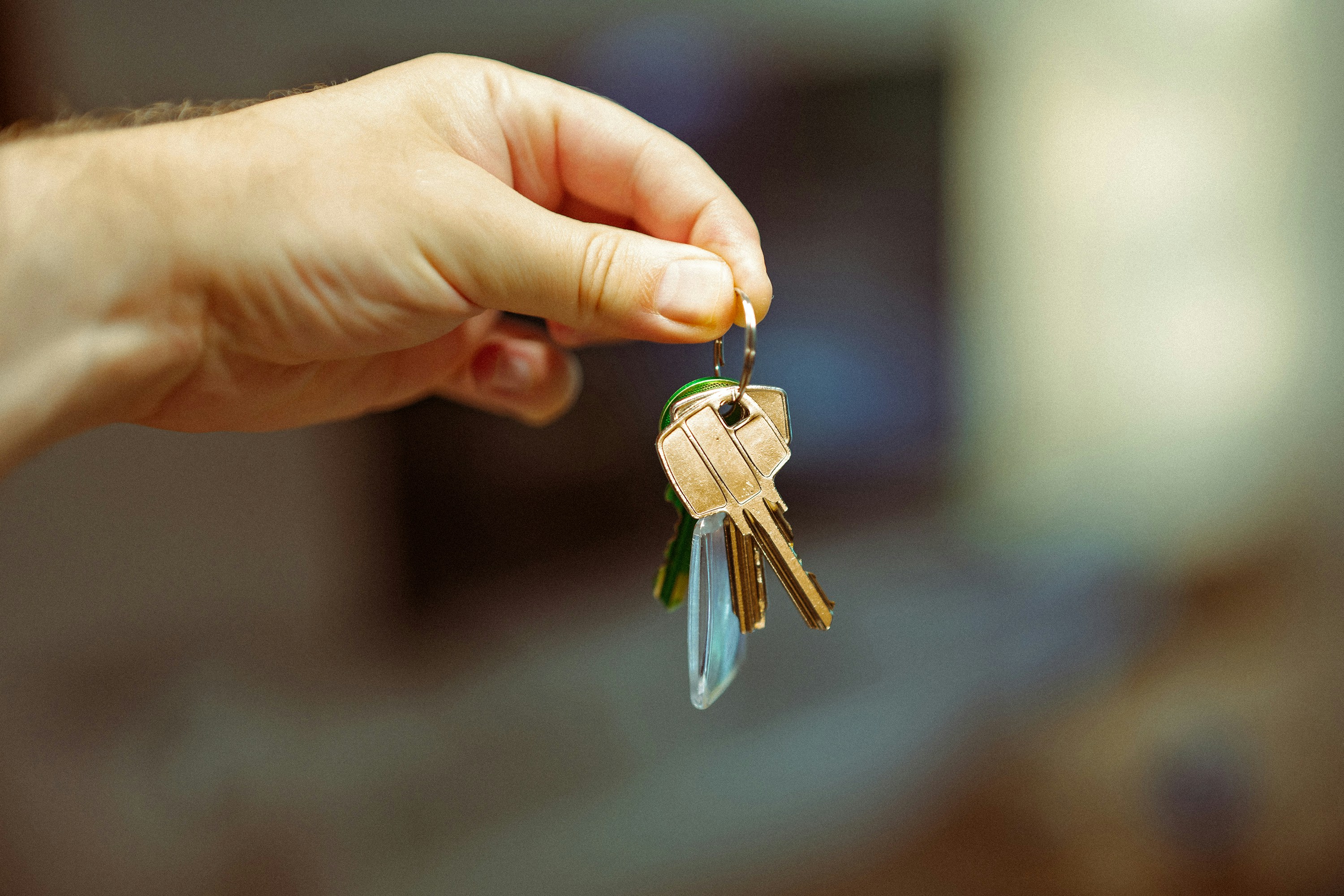 A first home buyer holding their new keys